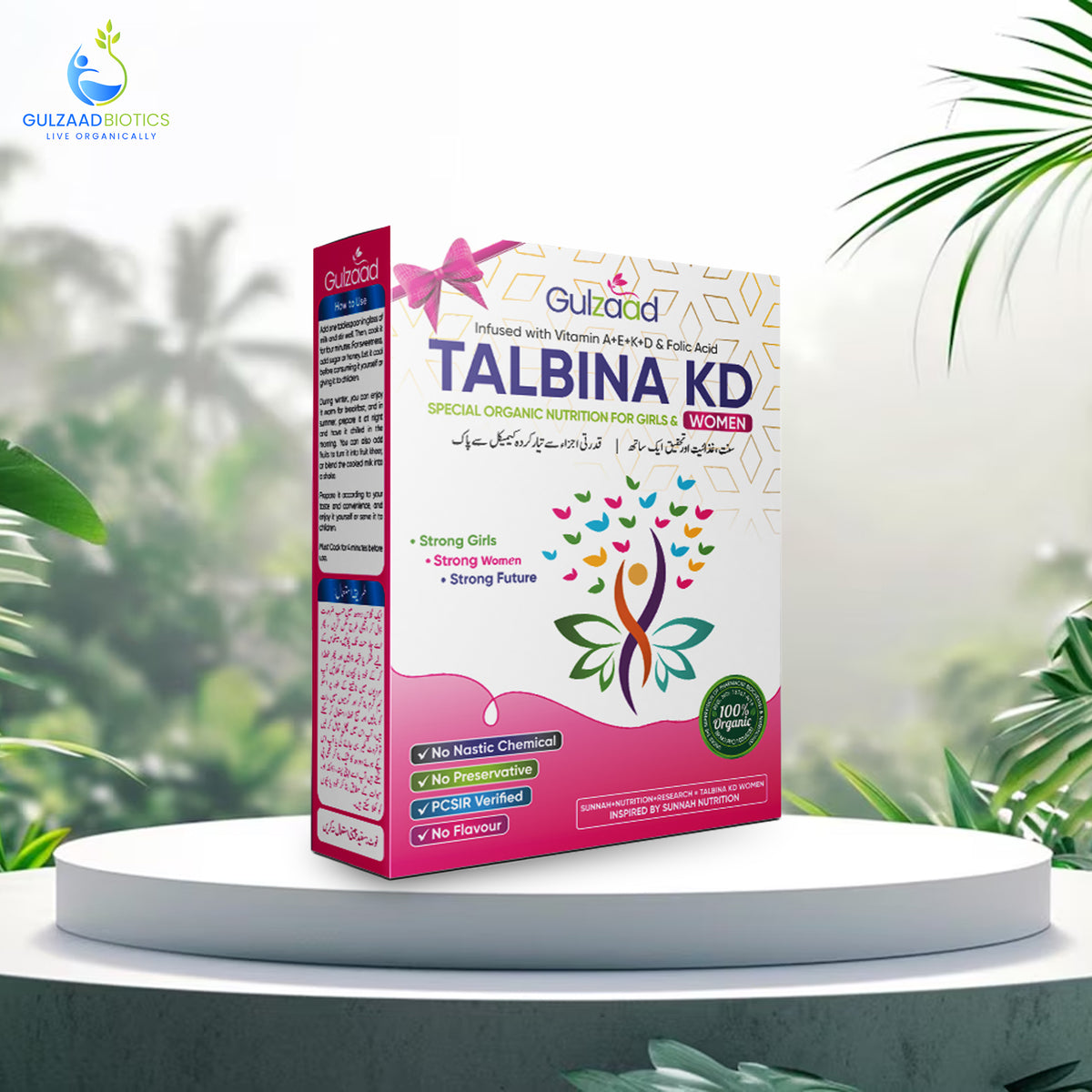 A box of Talbina KD Women's Nutritional Organic Food on a display stand with a tropical background, featuring the product name, benefits, and Ingredients.